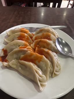 An ordinary phone photo of momos on a plate